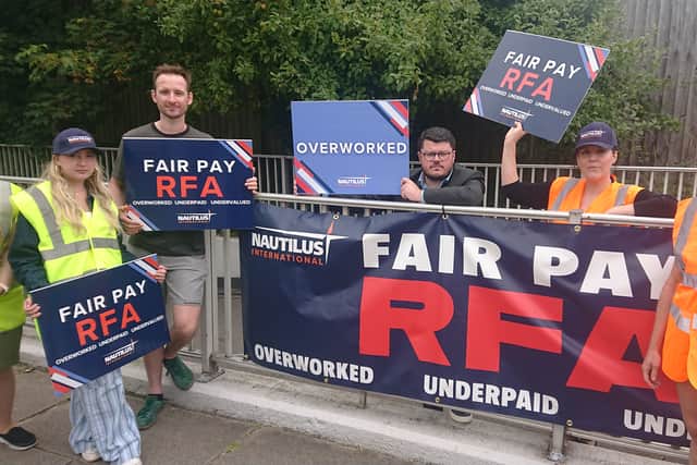 A new pay deal struck for Royal Fleet Auxiliary sailors has been hailed as a success, but more work needs to be done to improve the force. Pictured: Royal Fleet Auxiliary staff, who are members of the Nautilus International Union, staged a demonstration near the military base on Whale Island.
