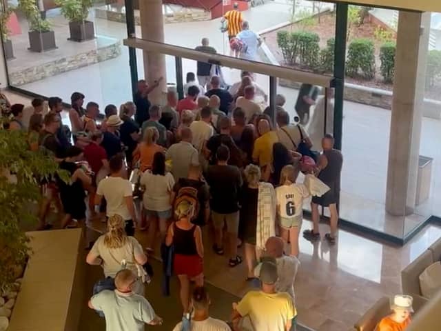 Holidaymakers queue at the doors of the Villa Romana hotel in Salou, Spain at 7.55am, on August 7, before making a chaotic dash for the sunbeds. 