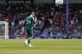 Thomas Kaminski heads to the dressing room following his first-half dismissal