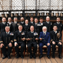 Royal Navy sailors based in Portsmouth have received a prestigious accolade after recovering migrant boats in the English Channel. Pictured: Rear Admiral Robert Pedre (Commodore UK Strike Force) with the Coastal Forces Squadron and Mr Tony Kelly.