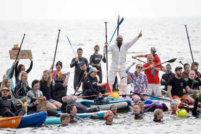 A Surfers Against Sewage paddle out protest in Brighton in May 2024.