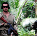 A Royal Marine from HMS-Lancaster and a Seychelles Special Forces Unit soldier move through the jungle during an exercise.