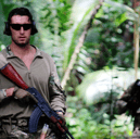 A Royal Marine from HMS-Lancaster and a Seychelles Special Forces Unit soldier move through the jungle during an exercise.