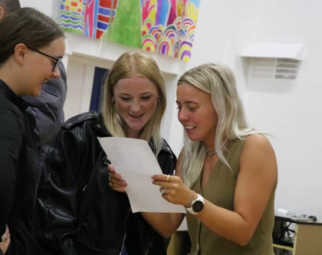 Sarah Gomez, PE Lead at The Portsmouth Academy, congratulates a pupil for their achievement