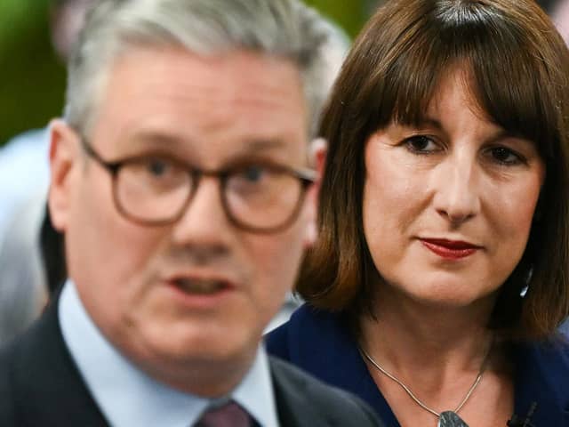 Rachel Reeves listens to Keir Starmer on the Labour general election campaign trail in May (Photo: JUSTIN TALLIS/AFP via Getty Images)