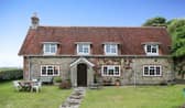 The listing says: "This truly stunning 4 bedroom detached character cottage which is nestled on the outskirts of rural Chale is an ideal family home."