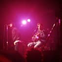 Liam Gallagher and Noel Gallagher of Oasis perform on stage at The Electric Ballroom, Camden on May 9 1996 (Photo by Getty Images) 