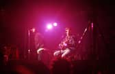 Liam Gallagher and Noel Gallagher of Oasis perform on stage at The Electric Ballroom, Camden on May 9 1996 (Photo by Getty Images) 