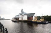 The MoD has confirmed that the Type 26 frigate programme has been delayed. Pictured is a new Royal Navy Type 26 frigate HMS Cardiff will be entering the water after leaving BAE Systems Govan shipyard.
