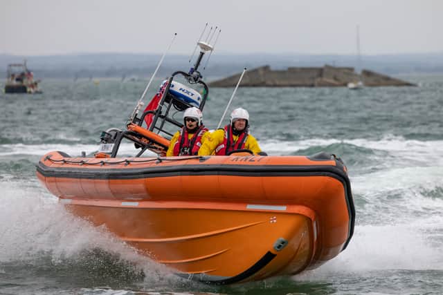 RNLI crews rescued four children who were stuck on paddle boards off the coast of Hayling Island. Pictured are lifeboat crews demonstrating their craft's manoeuvrability during the open day at Langstone Harbour on August 31. Picture: Mike Cooter (310824)