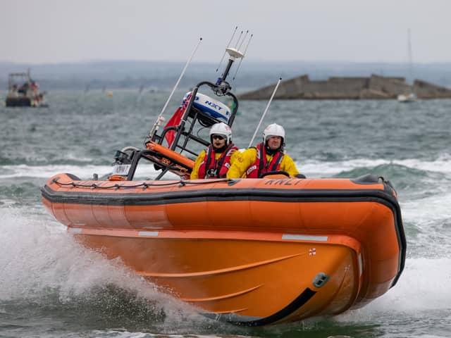 RNLI crews rescued four children who were stuck on paddle boards off the coast of Hayling Island. Pictured are lifeboat crews demonstrating their craft's manoeuvrability during the open day at Langstone Harbour on August 31. Picture: Mike Cooter (310824)