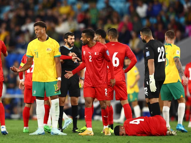 Pompey's Kusini Yengi is sent off for Australia against Bahrain today. Pic: Getty.