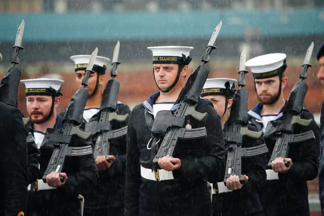 Royal Navy personnel from HMS Diamond stand on parade in the rain during a visit from Defence Secretary John Healey at HM Naval Base Portsmouth at Portsmouth Historic Dockyard.