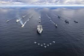 The size of the Royal Navy fleet is being reviewed by the Ministry of Defence (MoD) as part of the government's Strategic Defence Review, with the goal of increasing defence spending to 2.5 per cent of GDP. 

Pictured: HMS Prince of Wales leading a fifteen ship formation - with jets flying past - as part of a UK-led Carrier Strike Group. Front row: HMS Prince of Wales
Row 2 (L-R): USS Paul Ignatius, ESPS Almirante Juan de Borbon, 
Row 3 (L-R): HMS Portland, HNLMS Karel Doorman, HNOMS Magnus Lagabote, RFA Tidespring, HNOMS Olav Tyrggvason, ITS Giuseppe Garibaldi, FS Normandie
Row 4 (L-R): RFA Mounts Bay, HNOMS Otto Sverdrup, HNOMS Gnist, Kv Bjornoya, FGS Bonn