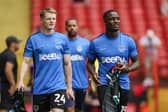 Terry Devlin, left, with Pompey team-mate Christian Saydee