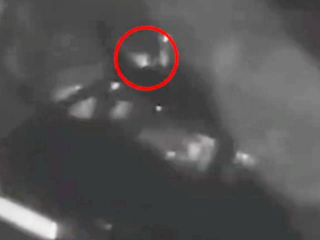 CCTV captures two men creeping up on the parked car 