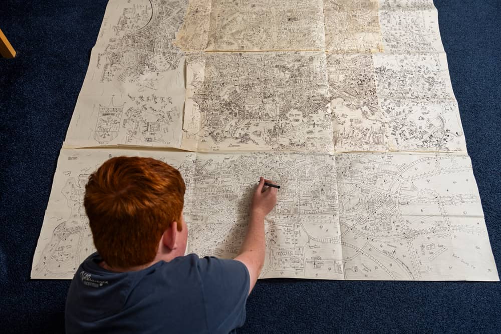 Jake Daniels-Shipsmith with his incredible city map which he has been working on for seven years. 