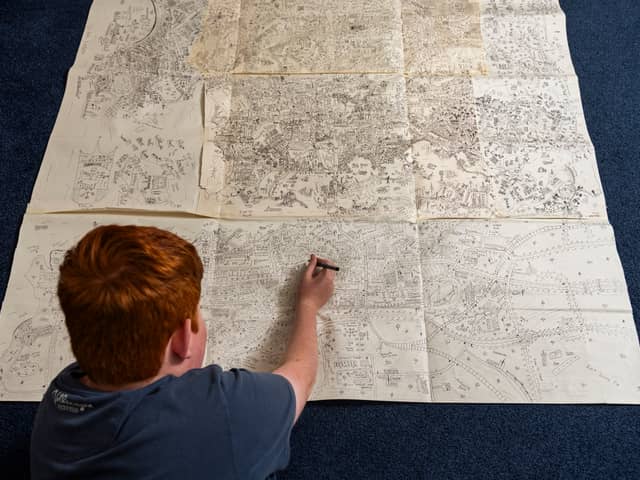 Jake Daniels-Shipsmith with his incredible city map which he has been working on for seven years. 