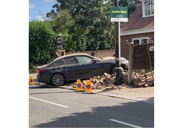 A BMW crashed into a wall of a for sale house off Hightown Road in Ringwood after a police chase