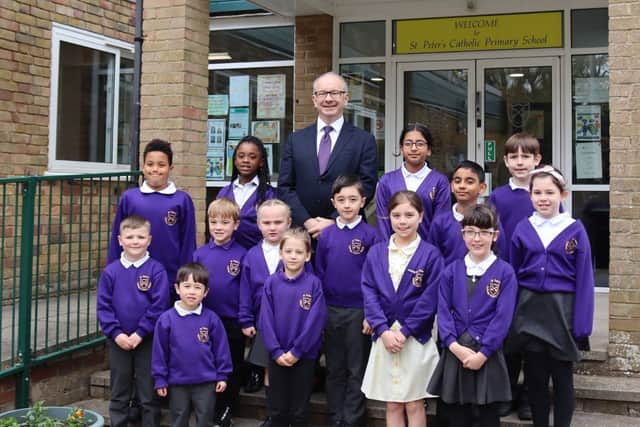 St Peter's Catholic Primary School in Waterlooville has been judged as an outstanding school by the Catholic Schools Inspectorate. 
Pictured: Richard Cunningham, headteacher, with pupils
