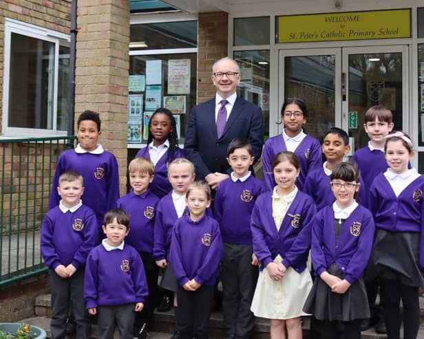 St Peter's Catholic Primary School in Waterlooville has been judged as an outstanding school by the Catholic Schools Inspectorate. 
Pictured: Richard Cunningham, headteacher, with pupils
