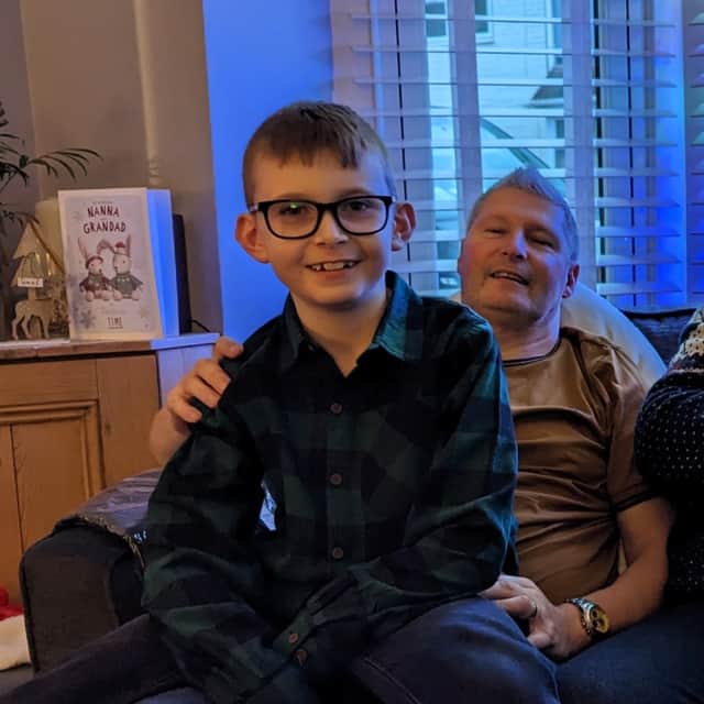 Ezra pictures with his 'Pops' Mark McCullough