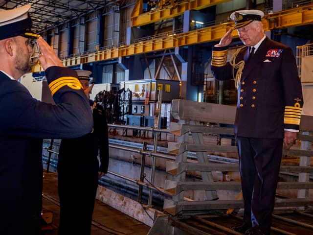 King Charles III saluting Commander Officer James Collie as he boards the Vanguard-class submarine during a visit to the Royal Naval Armaments Depot, Coulport, part of HM Naval Base Clyde. Picture date: Thursday September 19, 2024.