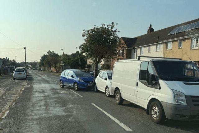 A picture of a Blue Honda after crashing into a parked white hatchback in Nobes Avenue, Gosport.