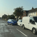 A picture of a Blue Honda after crashing into a parked white hatchback in Nobes Avenue, Gosport.