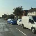 A picture of a Blue Honda after crashing into a parked white hatchback in Nobes Avenue, Gosport.