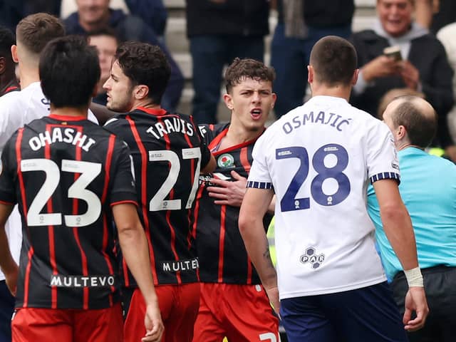 Blackburn defender Owen Beck confronts Preston's Milutin Osmajic about an alleged bite during Sunday's Championship game at Deepdale