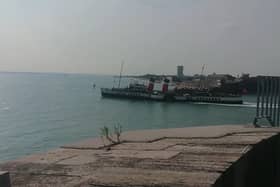 PS Waverley sailing alongside Portsmouth as she continues her summer season on the south coast.