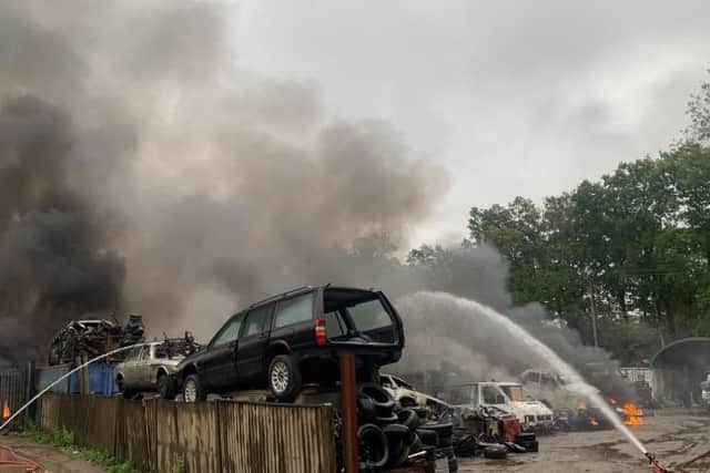 Scrapyard blaze creates large smoke plume over Aldershot.