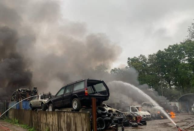Scrapyard blaze creates large smoke plume over Aldershot.