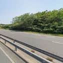 A motorbike rider is fighting for his life in hospital after a collision involving a van on the A27.