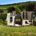 This home comes with five bedrooms, five bathrooms and four reception rooms. 