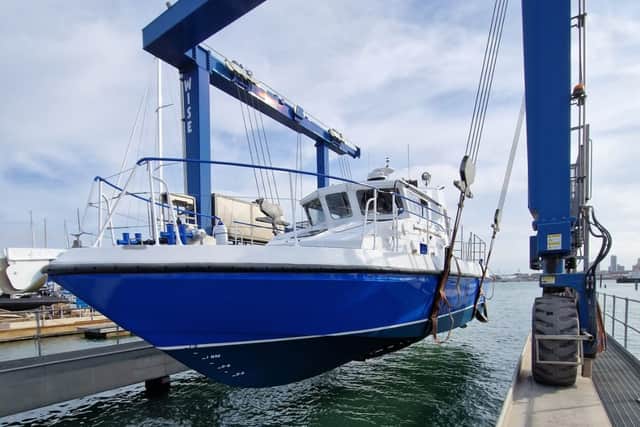 The gleaming new MV Lady Jean is lifted back into the water by the UK Docks Marine Services team ahead of her long journey from Gosport to Lake Victoria. The former HMS Scimitar, a Royal Navy patrol boat used in Gibraltar, has been converted into a medical vessel.
