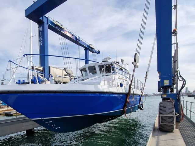 The gleaming new MV Lady Jean is lifted back into the water by the UK Docks Marine Services team ahead of her long journey from Gosport to Lake Victoria. The former HMS Scimitar, a Royal Navy patrol boat used in Gibraltar, has been converted into a medical vessel.