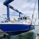 The gleaming new MV Lady Jean is lifted back into the water by the UK Docks Marine Services team ahead of her long journey from Gosport to Lake Victoria. The former HMS Scimitar, a Royal Navy patrol boat used in Gibraltar, has been converted into a medical vessel.
