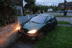 A crashed Peugeot was seen in the front garden of a house in Bedhampton. Police have charged a man with drink driving and other offences.