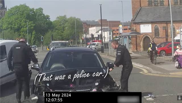 Driver crashes into back of police car.