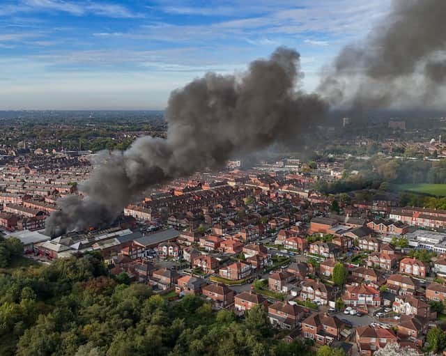 Aerial images show fire fighters tackling flames of a huge fire in Manchester