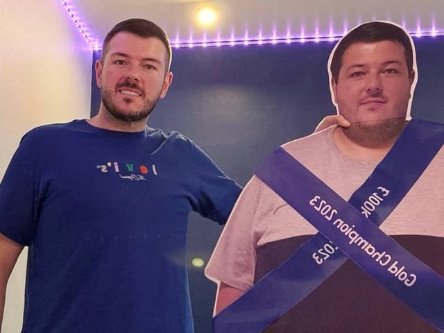 A former secret eater celebrated his 12 stone weight loss with a CARDBOARD CUT OUT showing his former XXXXL frame.