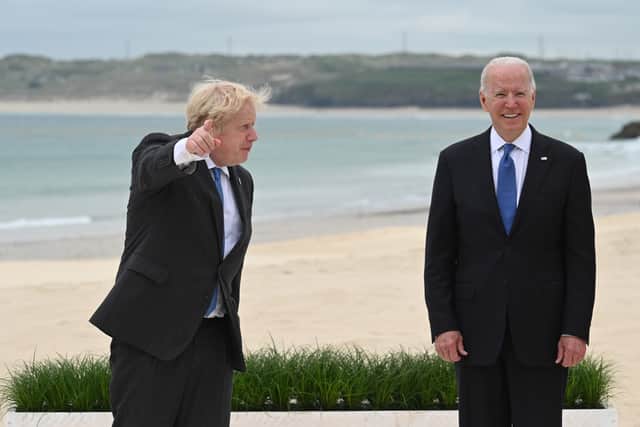 Former prime minister Boris Johnson has claimed that Joe Biden declined to board Royal Navy aircraft carrier HMS Prince of Wales because there were "too many steps". Pictured are Mr Johnson and Mr Biden at the G7 summit in Cornwall in 2021.