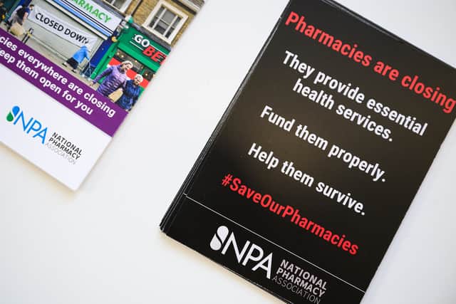 A poster tells patients about pharmacy closures.