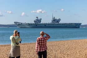 HMS Prince Of Wales visited Glen Mallen in Scotland to take on ammunition and supplies ahead of her Indo-Pacific deployment. Pictured is the Royal Navy flagship departing from Portsmouth ahead of a North Sea exercise.