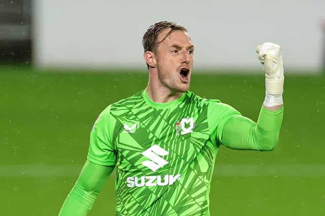 Former Pompey keeper Craig MacGillivray celebrates a pulled off three penalty saves against Arsenal under-21s. Picture: David Rogers/Getty Images