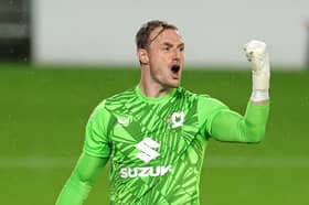 Former Pompey keeper Craig MacGillivray celebrates a pulled off three penalty saves against Arsenal under-21s. Picture: David Rogers/Getty Images