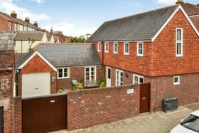 The listing says: "A unique opportunity to acquire a detached Coach House that was built in 1995 to a bespoke architectural design, the L shaped accommodation is arranged over two floors, providing 1403 sq ft of living space over two floors." 