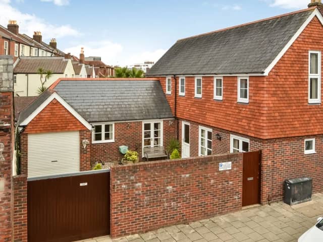 The listing says: "A unique opportunity to acquire a detached Coach House that was built in 1995 to a bespoke architectural design, the L shaped accommodation is arranged over two floors, providing 1403 sq ft of living space over two floors." 
